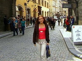Teen Claudia walks along the streets of Prague