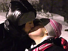 Two winter teens Linda and Lilly kissing